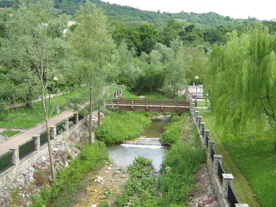 Bridge and garden over a branch of the Sangro River near the entrance to Alfedena in 2004