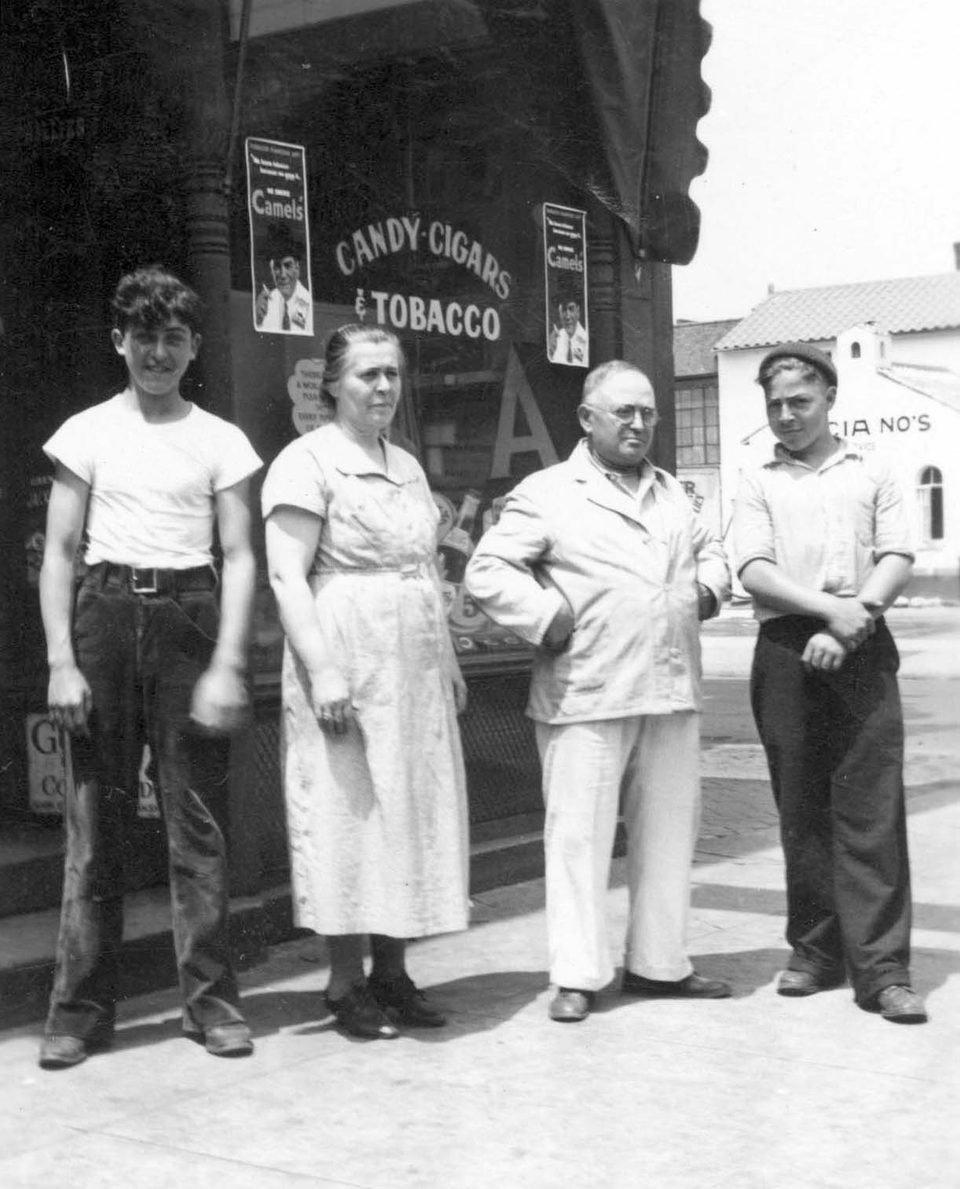 Nick and Mary Monacelli DiLoreto with their sons William and Julio outside their store in Erie, Pennsylvania